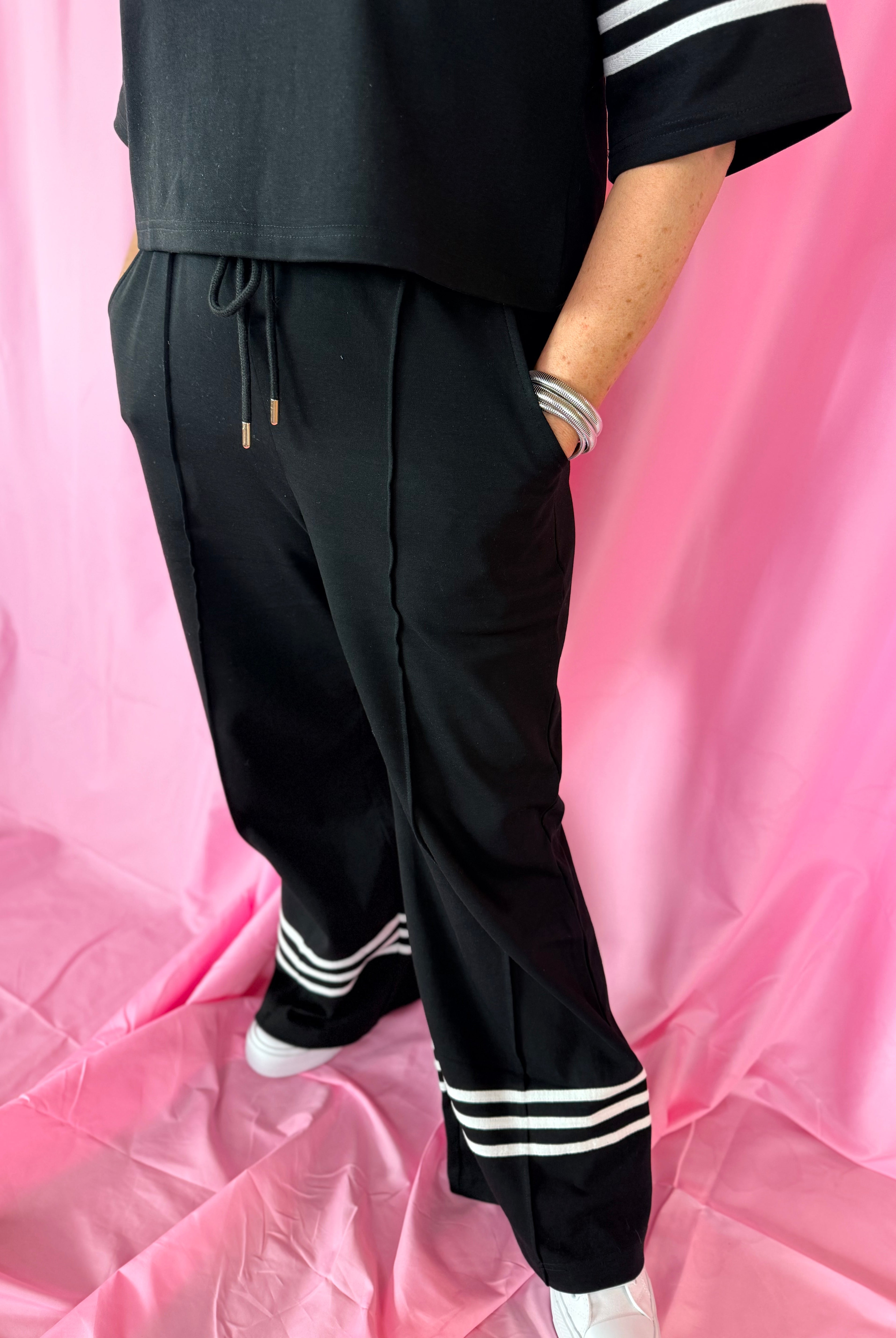 Black & White Stripe Entro Matching Set: Black wide-leg pants with drawstring waist and triple white stripe detail at the