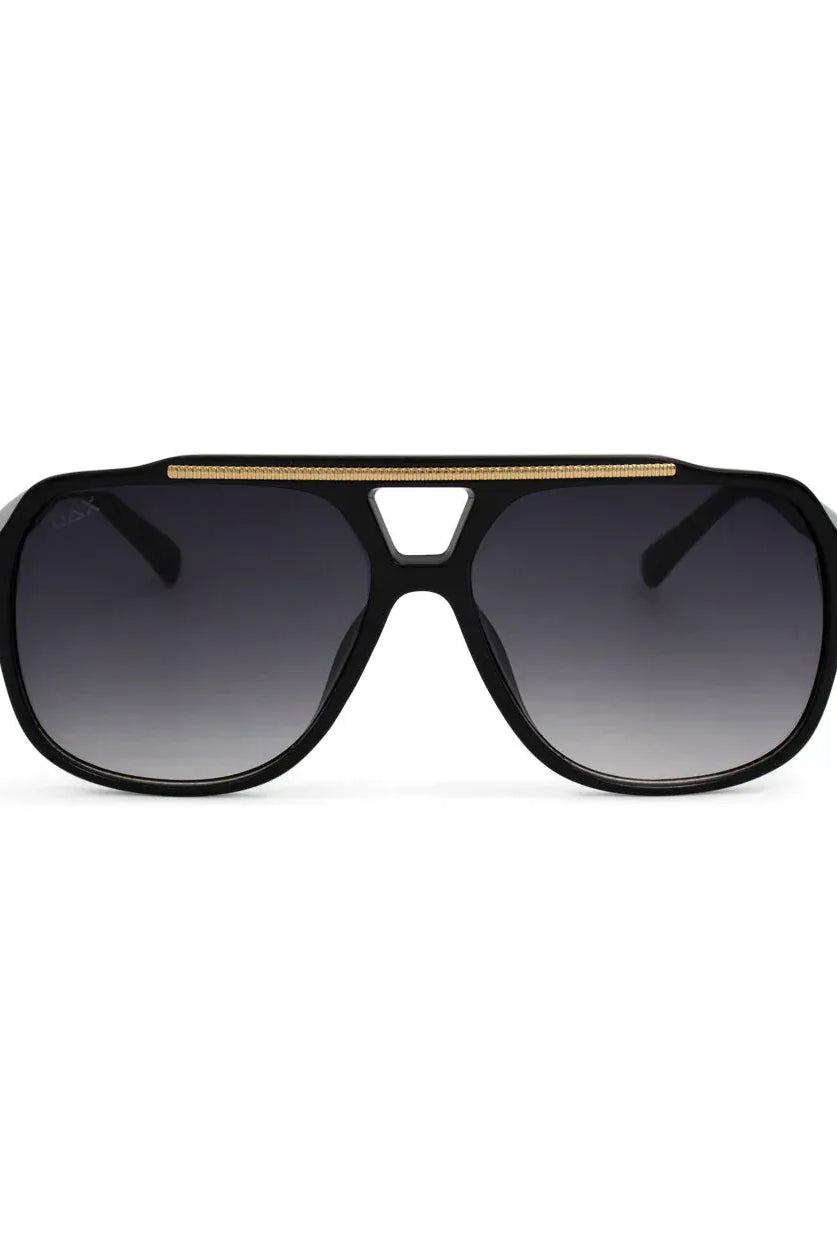 Astrid oversized aviator sunglasses with black frames, gold detail across the top, and gradient grey lenses.