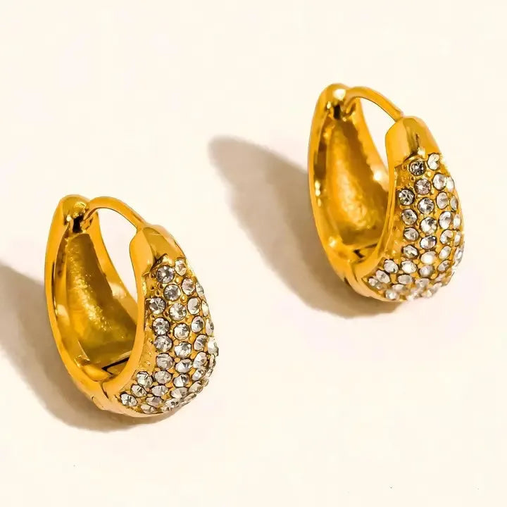 Aurven 18K gold teardrop hoop earrings paved with clear crystals.