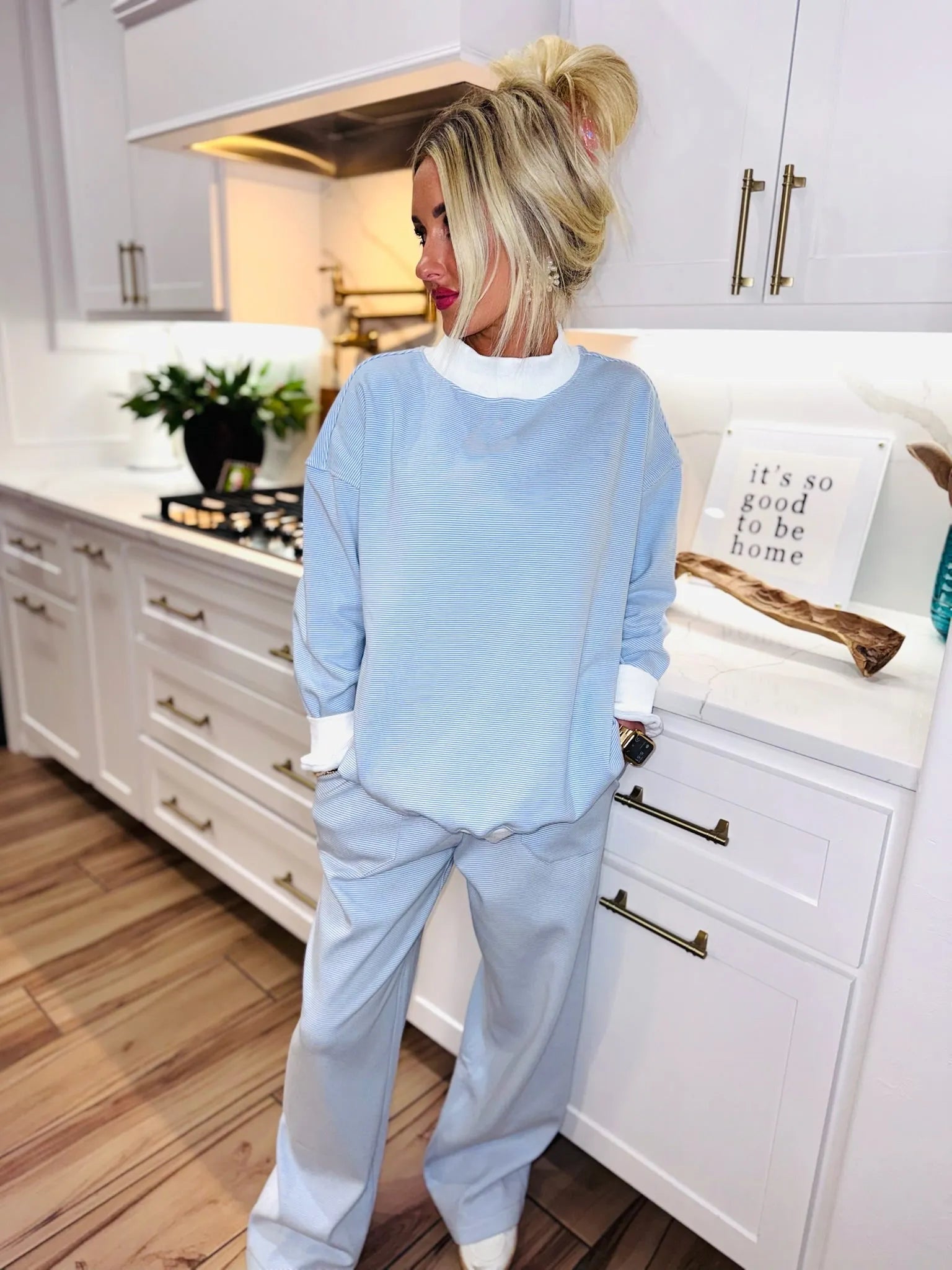 Light blue striped active sweatpants set with white trim on the collar and cuffs. Loose fit trousers with a relaxed