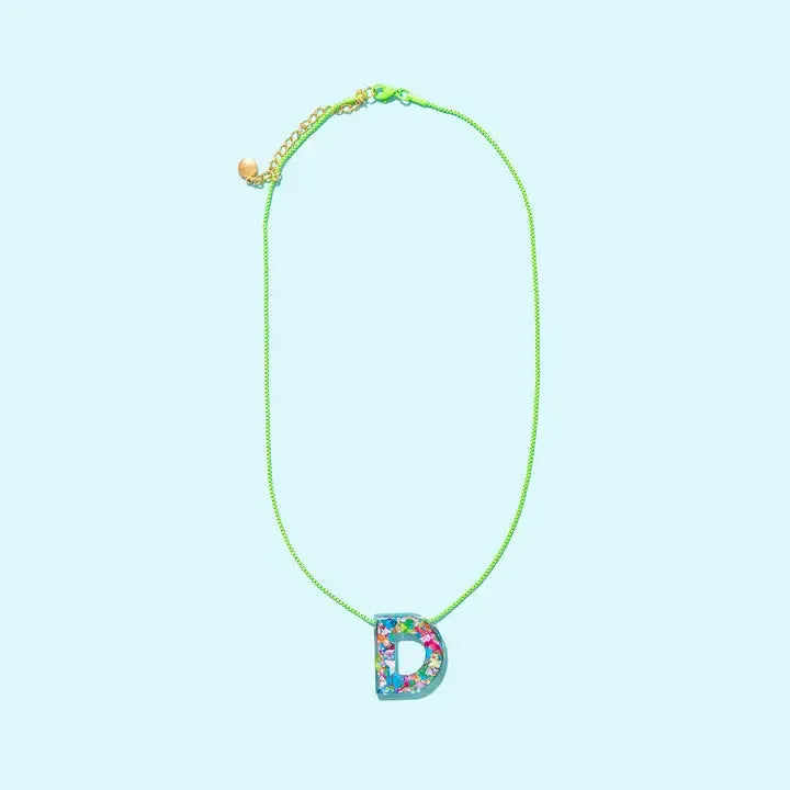 Confetti initial 'D' necklace with a clear resin pendant filled with colorful confetti on a neon green chain.
