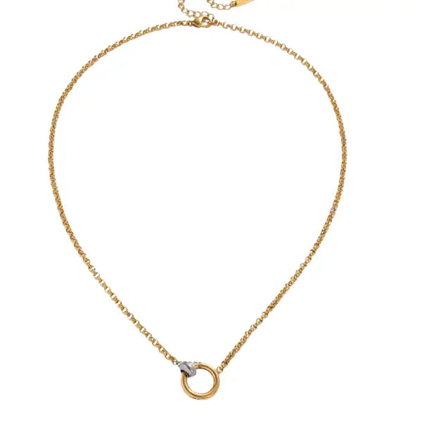 Gold chain necklace with a circular charm featuring a two-tone push-lock closure detail.