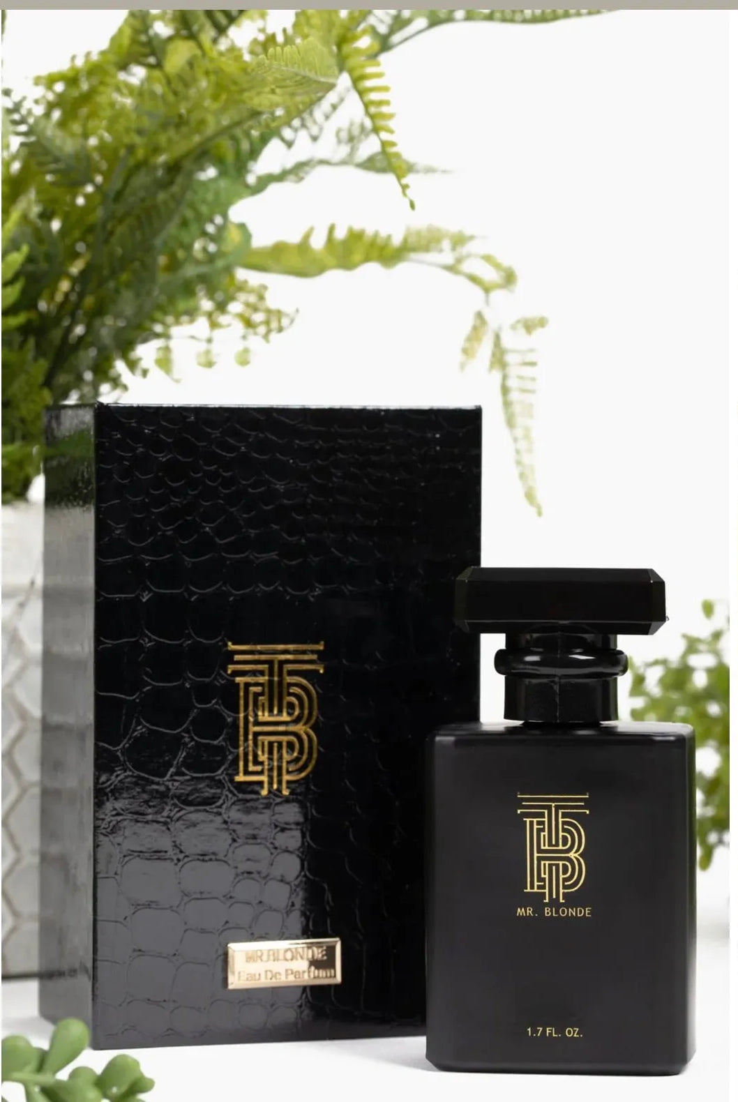 Black Eau de Parfum bottle by Thomas Blonde with gold logo and textured black box. 1.7 FL. OZ.