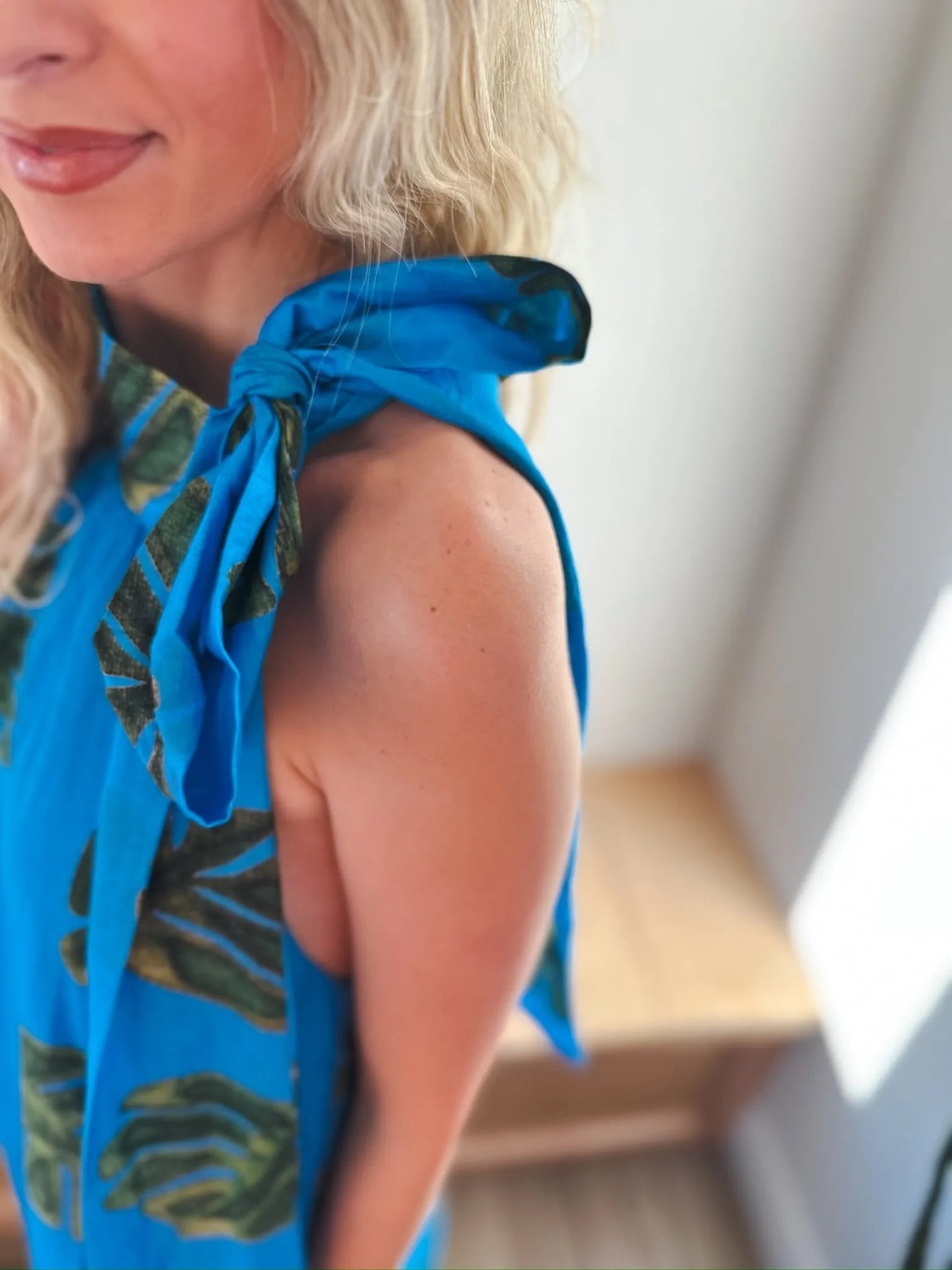 Entro blue maxi dress with tie neck, featuring a palm leaf print and shoulder ties.