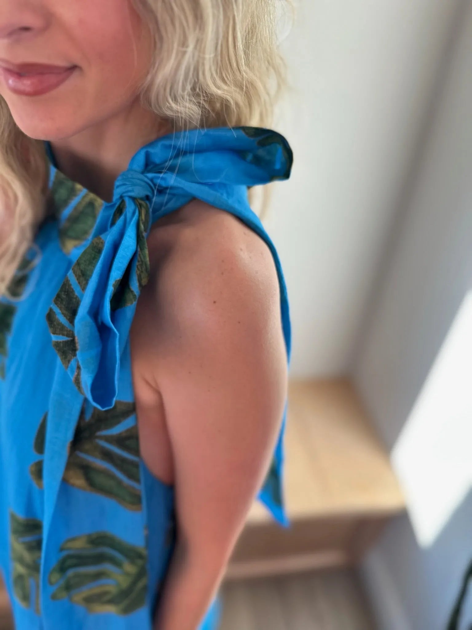 Entro blue maxi dress with green palm print and tie shoulder straps.