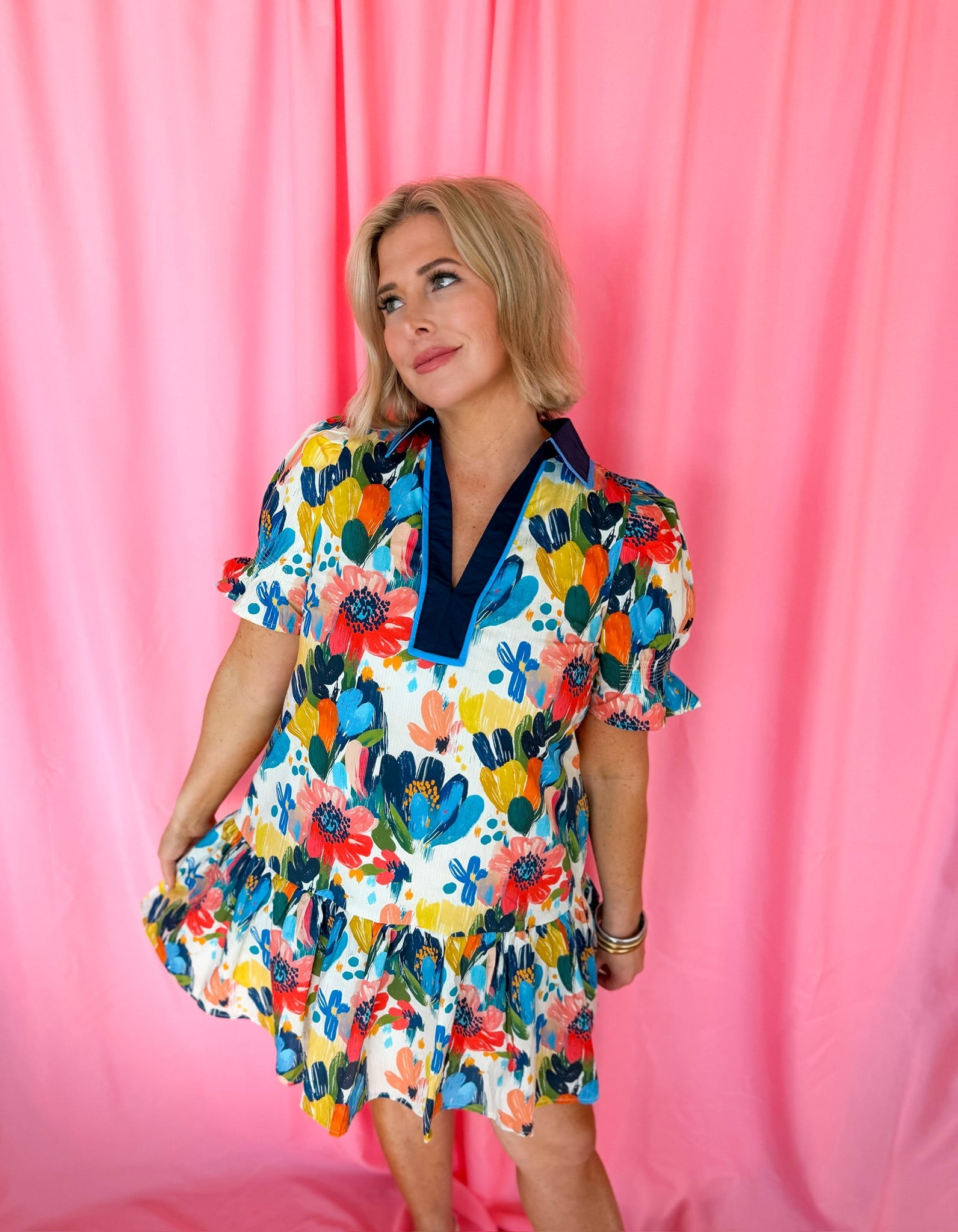 Entro blue spring flower puffer sleeve dress with a vibrant floral print. The dress features a collared neckline, short