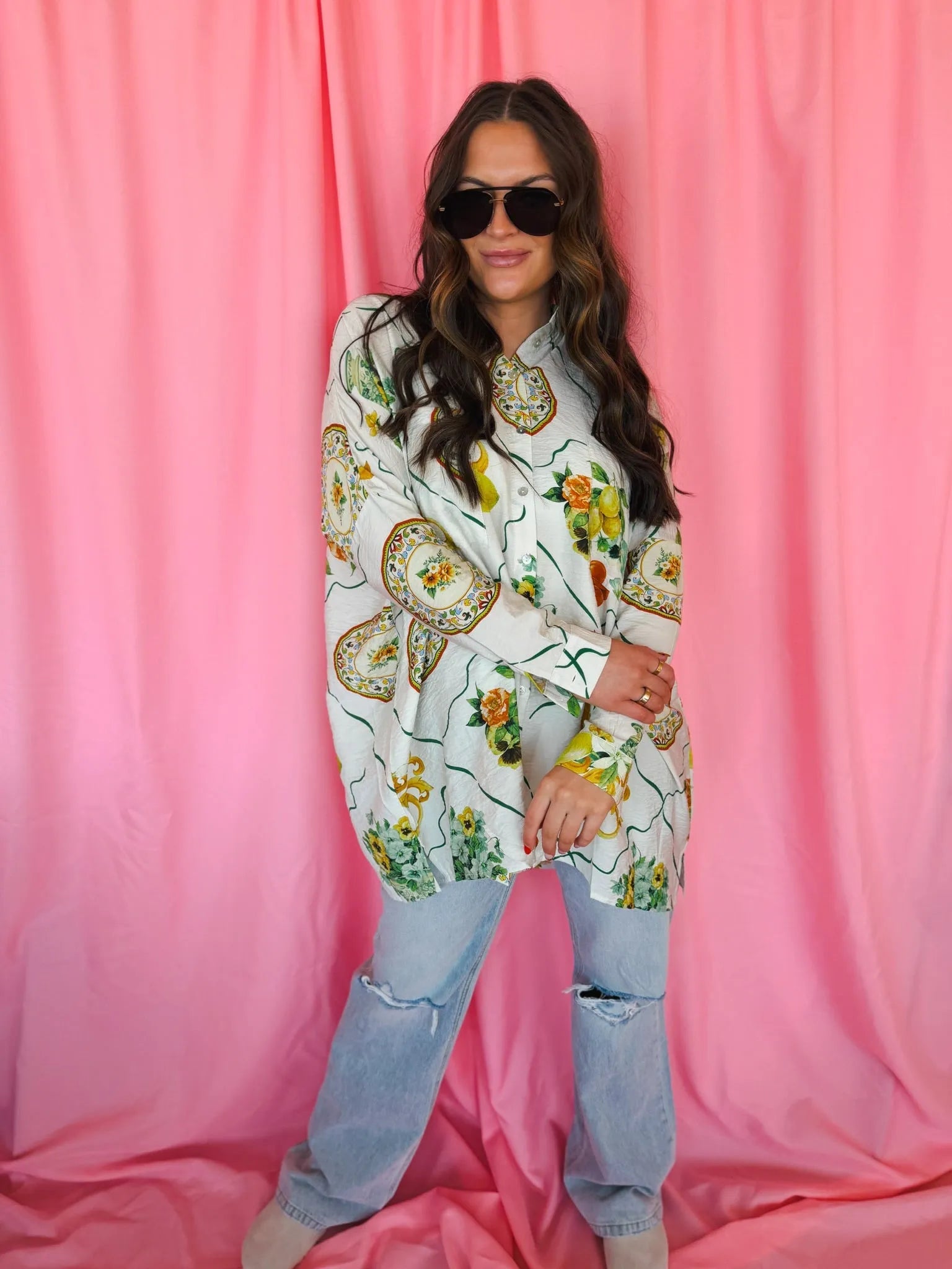 Entro Citrus Garden oversized button-down top with a white base and a print of yellow lemons, green leaves, and floral