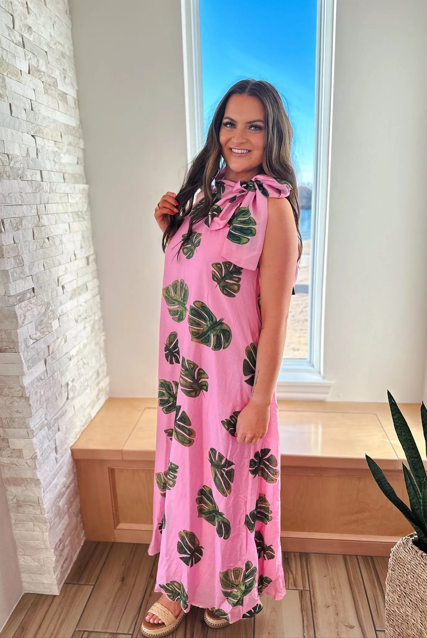 Entro pink maxi dress with green palm leaf print and tie neck.