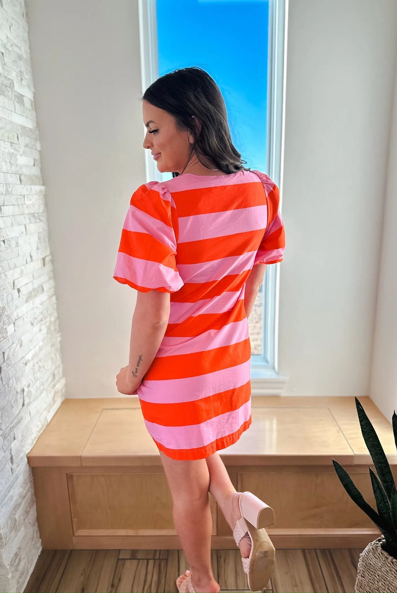 Entro red and pink horizontal striped short sleeve dress with a button front.