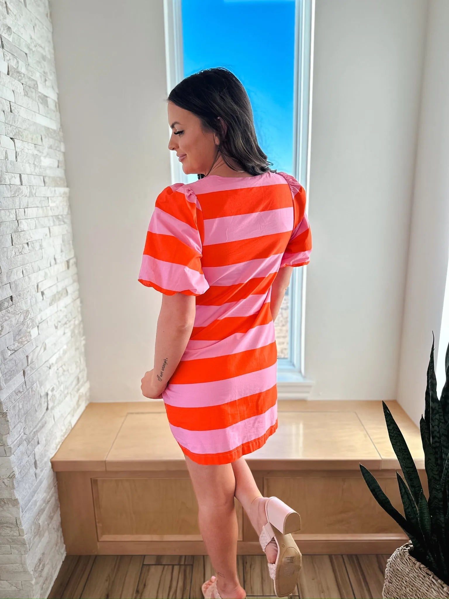 Entro red and pink horizontal striped short sleeve dress with a button front.