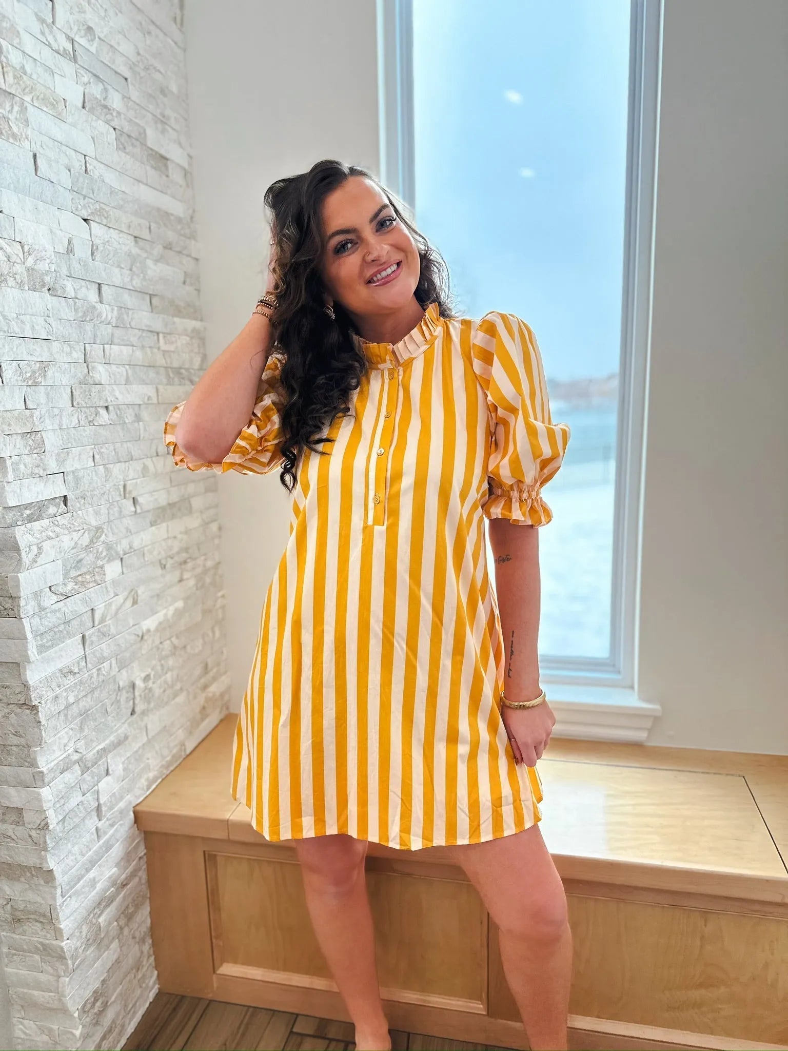 Entro yellow and white striped cotton dress with ruffle neck and puff sleeves, hitting above the knee.