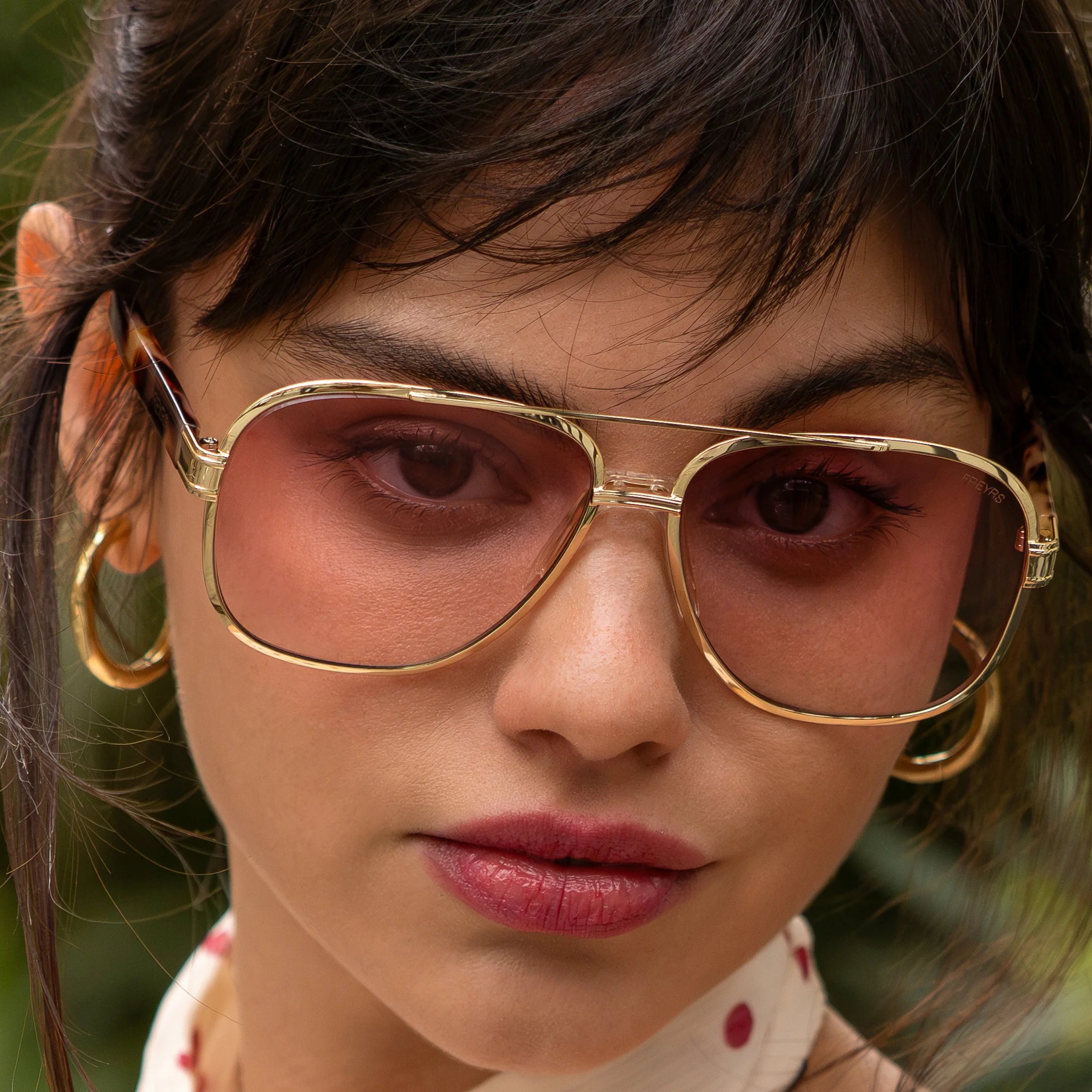 FREYRS CARTER unisex aviator sunglasses with gold double-bridge frames and pink tinted lenses worn by a model.