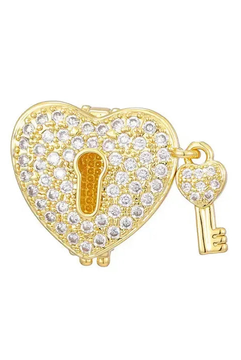 Gold-plated heart-shaped slider charm encrusted with clear cubic zirconia, featuring a keyhole and a dangling heart-shaped