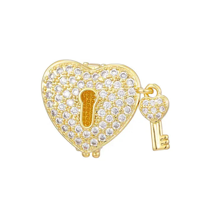 Gold-plated heart-shaped slider charm encrusted with clear cubic zirconia, featuring a keyhole and a dangling heart-shaped