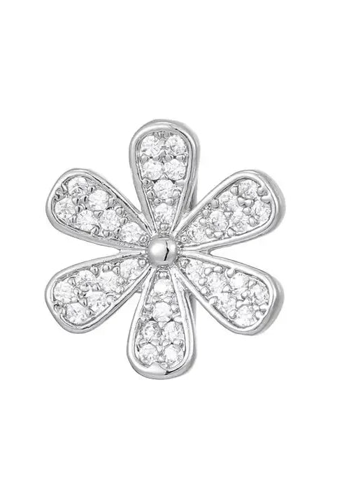 Silver flower charm with pave-set cubic zirconia (CZ) stones. Designed as a slider charm for bracelets.