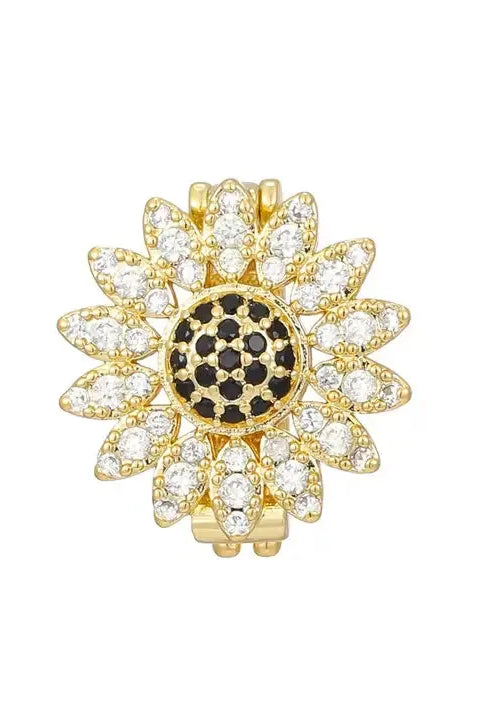 Gold plated sunflower charm with black CZ center and clear CZ petals, for bracelets.