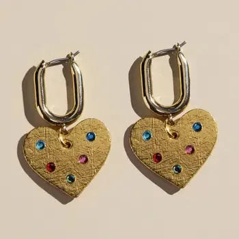 Gold pavé checkered heart huggie earrings with colorful gemstones. Oval hoops with dangling heart charms.
