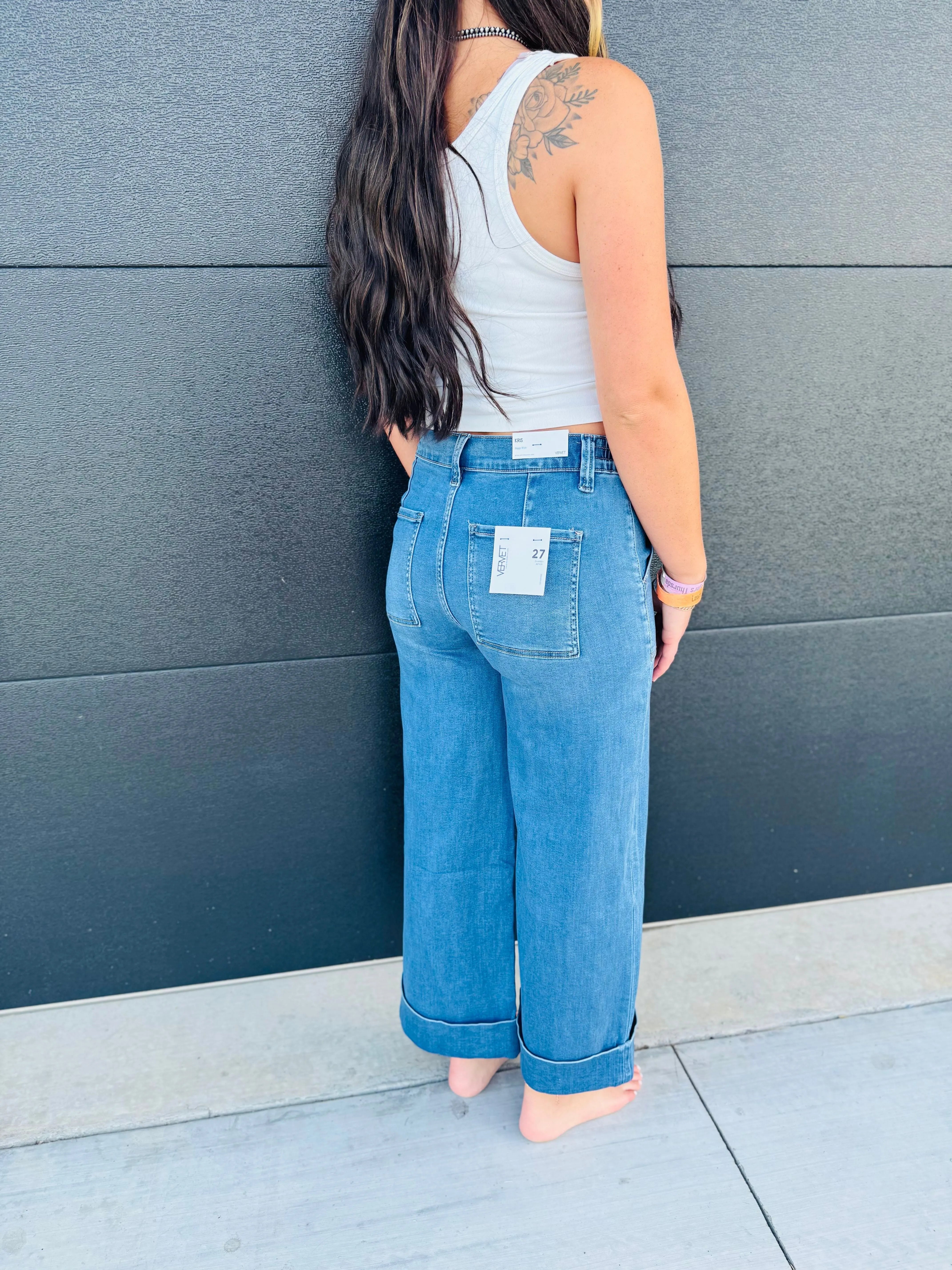 Vervet high rise baggy wide jeans in light wash denim with double cuffs and patch pockets. Model is wearing size 27.