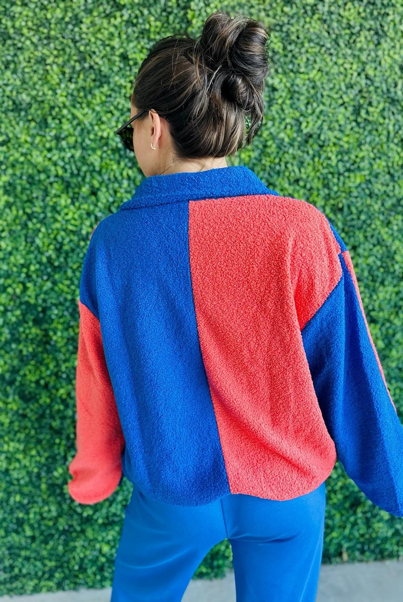 J.anna Sherpa zip-up jacket, color block blue and coral, fuzzy texture, seen from back.