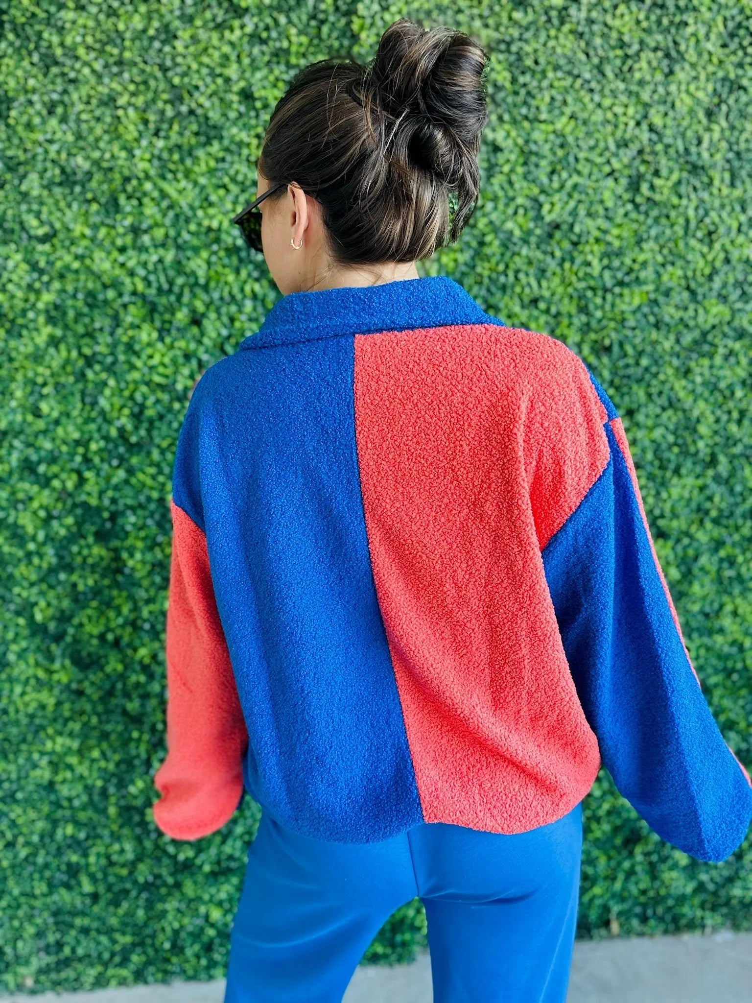 J.anna Sherpa zip-up jacket, color block blue and coral, fuzzy texture, seen from back.