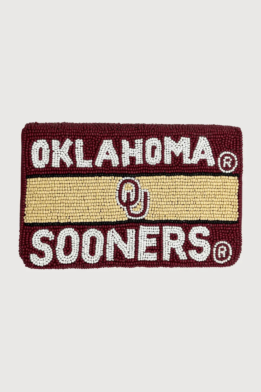 Maroon beaded mini clutch with "OKLAHOMA" in white beads above a cream stripe featuring the OU logo, and "SOONERS" in white