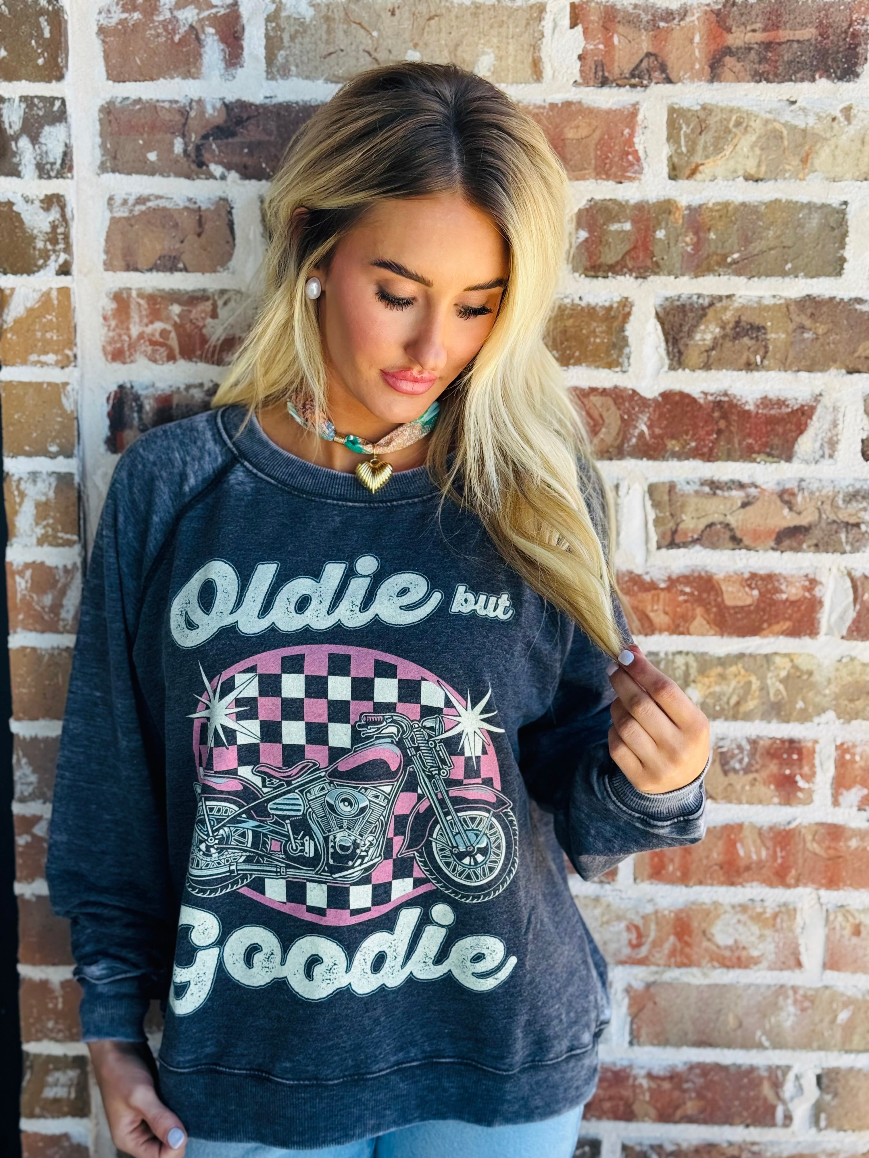 Recycled Karma "Oldie but Goodie" charcoal graphic sweatshirt with a pink checkered oval featuring a motorcycle and stars.