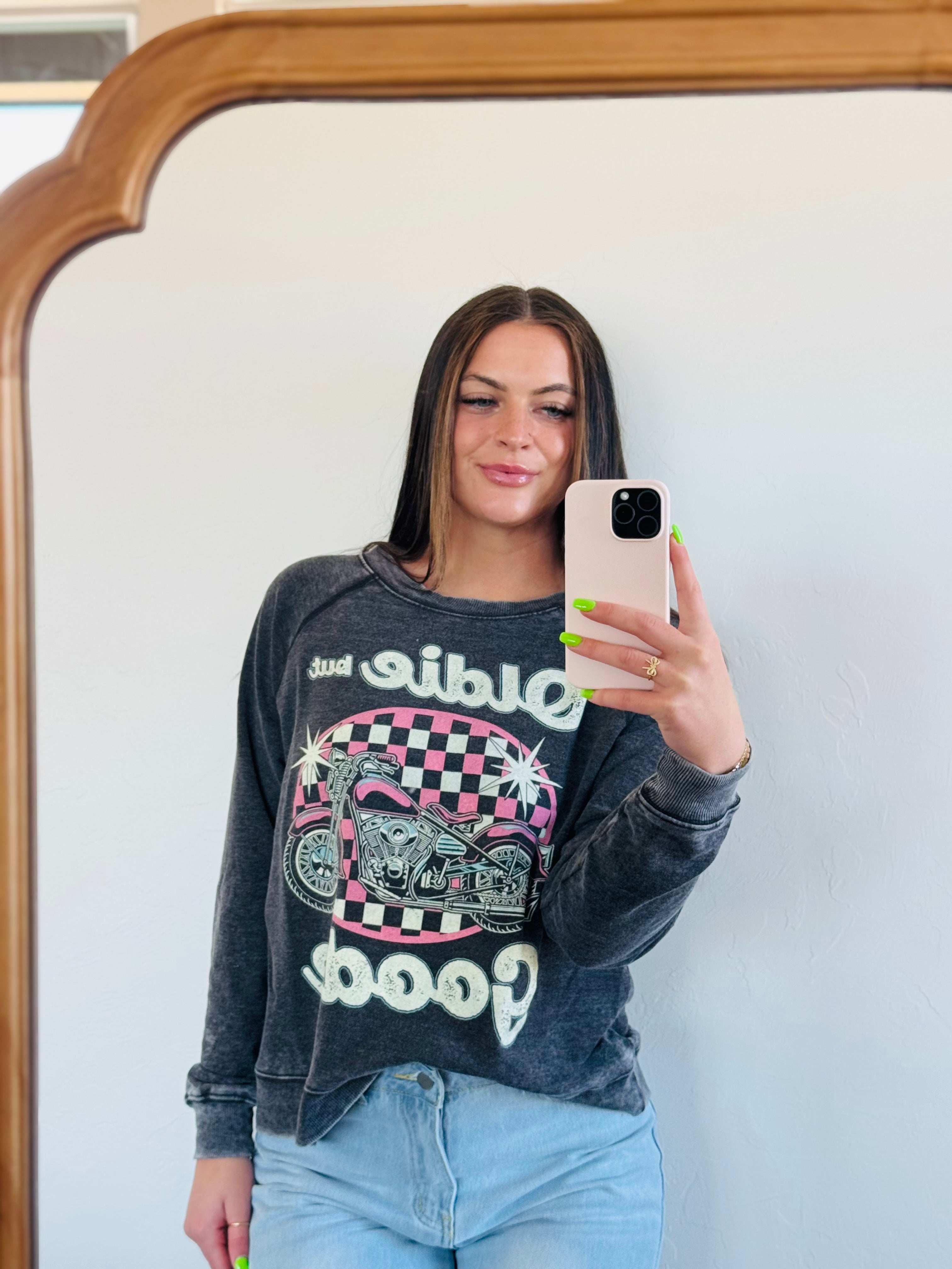 Recycled Karma "Oldie But Goodie" graphic sweatshirt featuring a pink and black checkerboard background with a pink