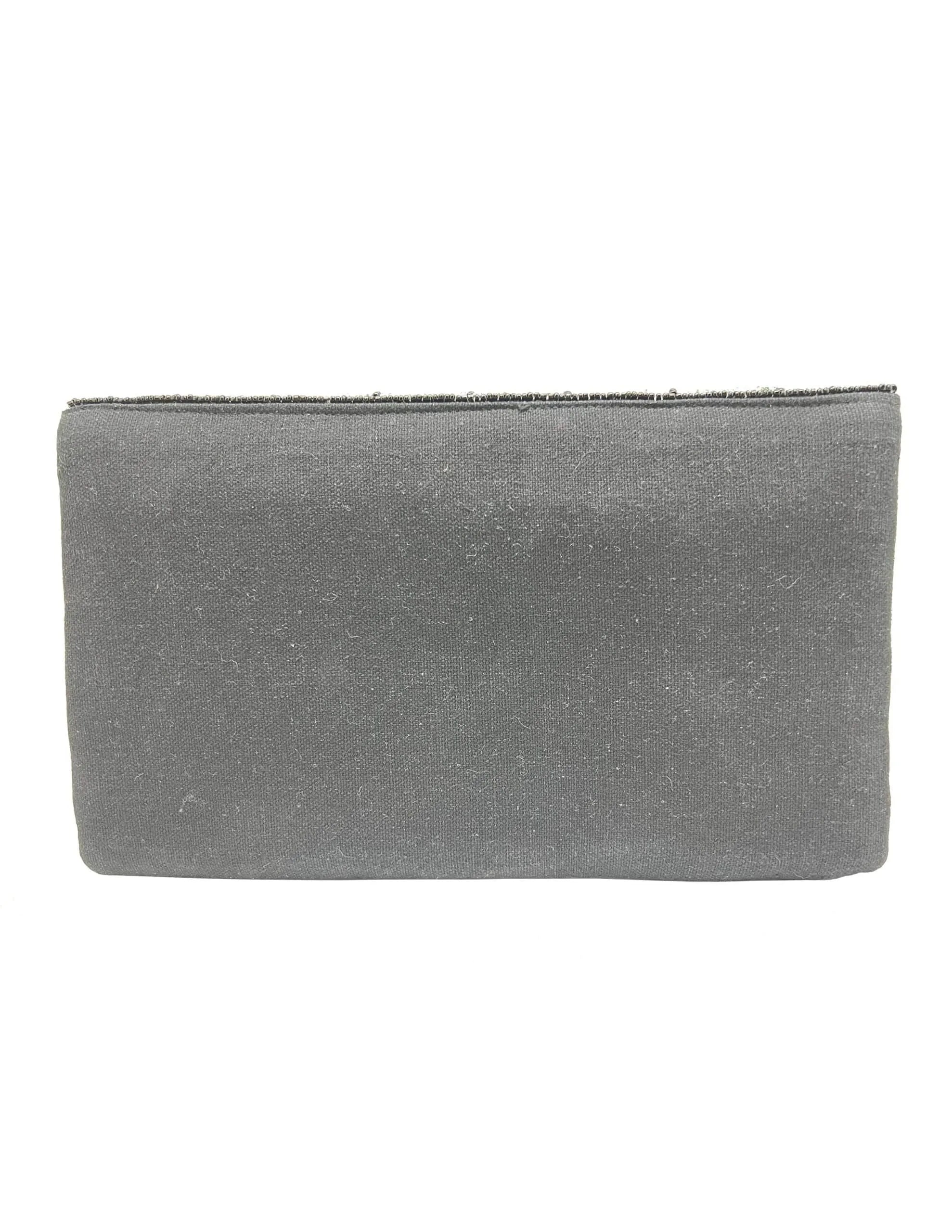 A plain, dark gray clutch bag with a beaded trim along the top edge.
