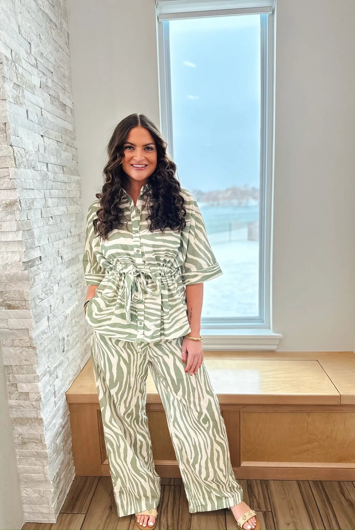 Sage and cream zebra print matching set by ENTRO. Short-sleeve collared shirt cinched at the waist with a tie, paired with