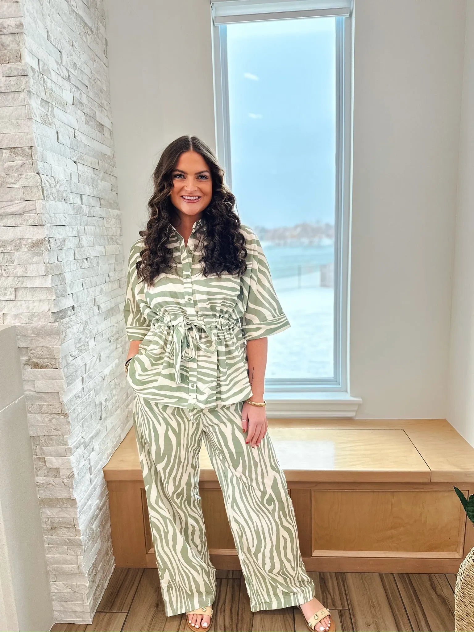 Sage and cream zebra print matching set by ENTRO. Short-sleeve collared shirt cinched at the waist with a tie, paired with