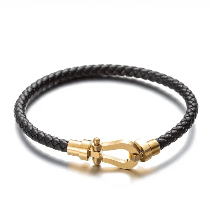 Sebastian black braided cord bracelet with gold horseshoe clasp, detailed view.