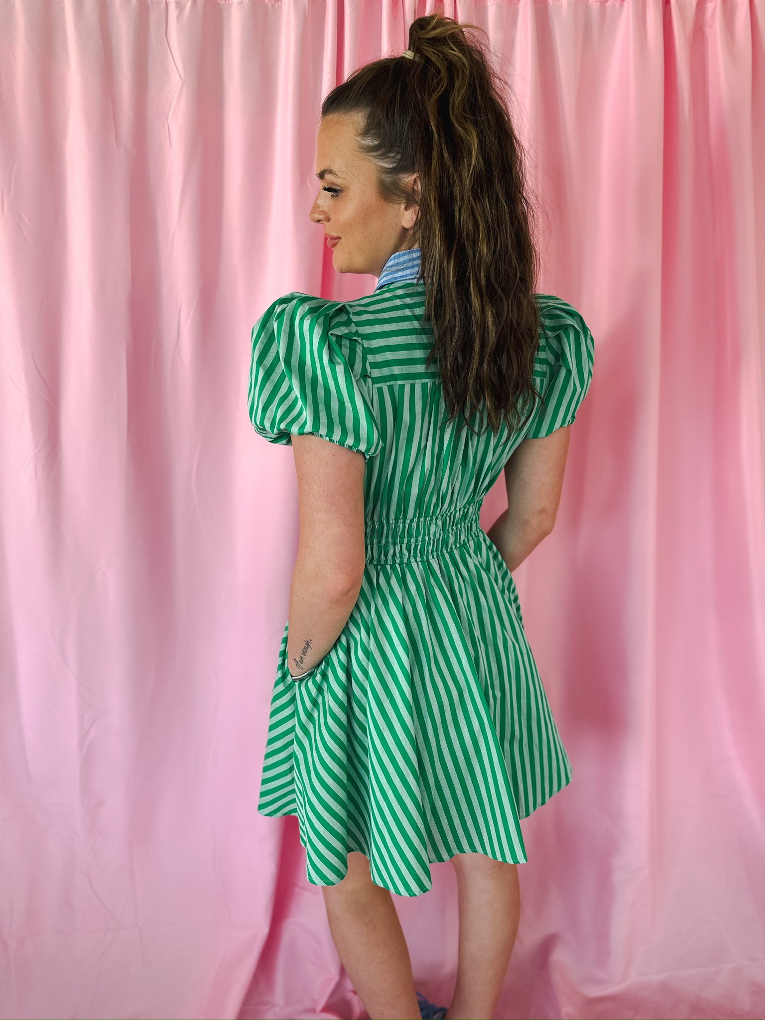 Entro green stripe puff sleeve dress on model, featuring blue contrast collar, green & white vertical stripes & shirred