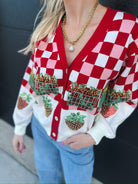 Queen of Sparkles red and white checkered sequin strawberry cardigan with front pockets and strawberry appliques.