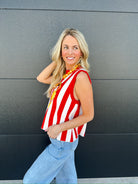 Queen of Sparkles red and white striped knit tank top with a hotdog graphic. Woman wearing light wash jeans.