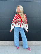 Red and white checkered cardigan with sequin strawberry baskets and individual strawberries. White sleeves and button front.