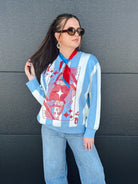 Queen of Sparkles sweater with light blue & white stripes and a red Queen of Hearts card graphic. Model wears jeans & scarf.