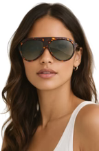 FREYRS MAXWELL sunglasses with tortoiseshell frame and gradient lenses worn by a woman.