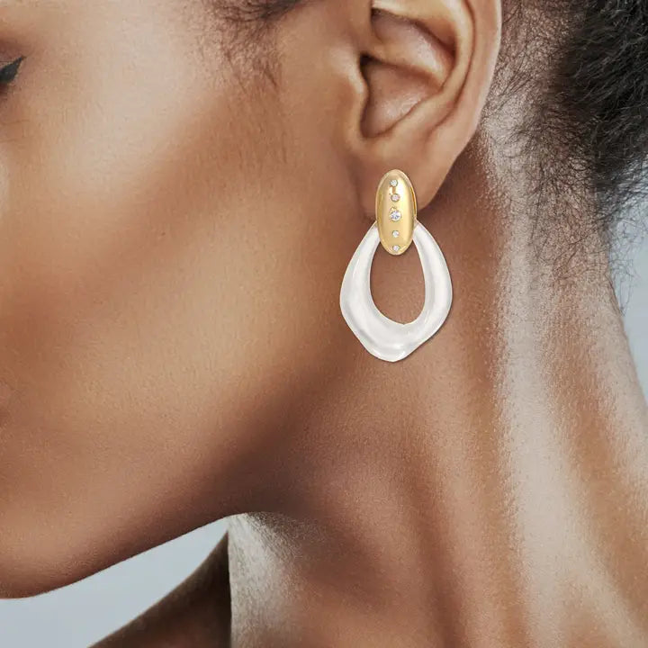 Gold oval stud with three small diamonds, suspending a clear acrylic tear-drop shaped earring.