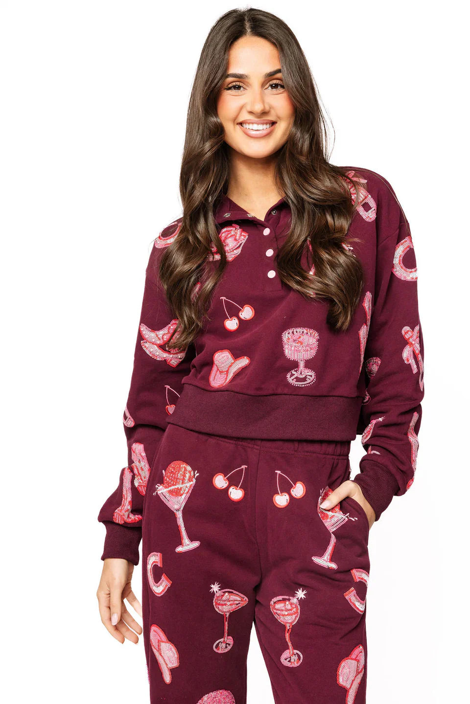 Dark plum pink henley sweatshirt with all-over disco cowgirl icons like cowboy hats, martini glasses, and cherries.