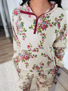 Davi & Dani Floral Half-Zip Set: Cream base with a scattered pink and red floral print. Features a burgundy zipper and trim