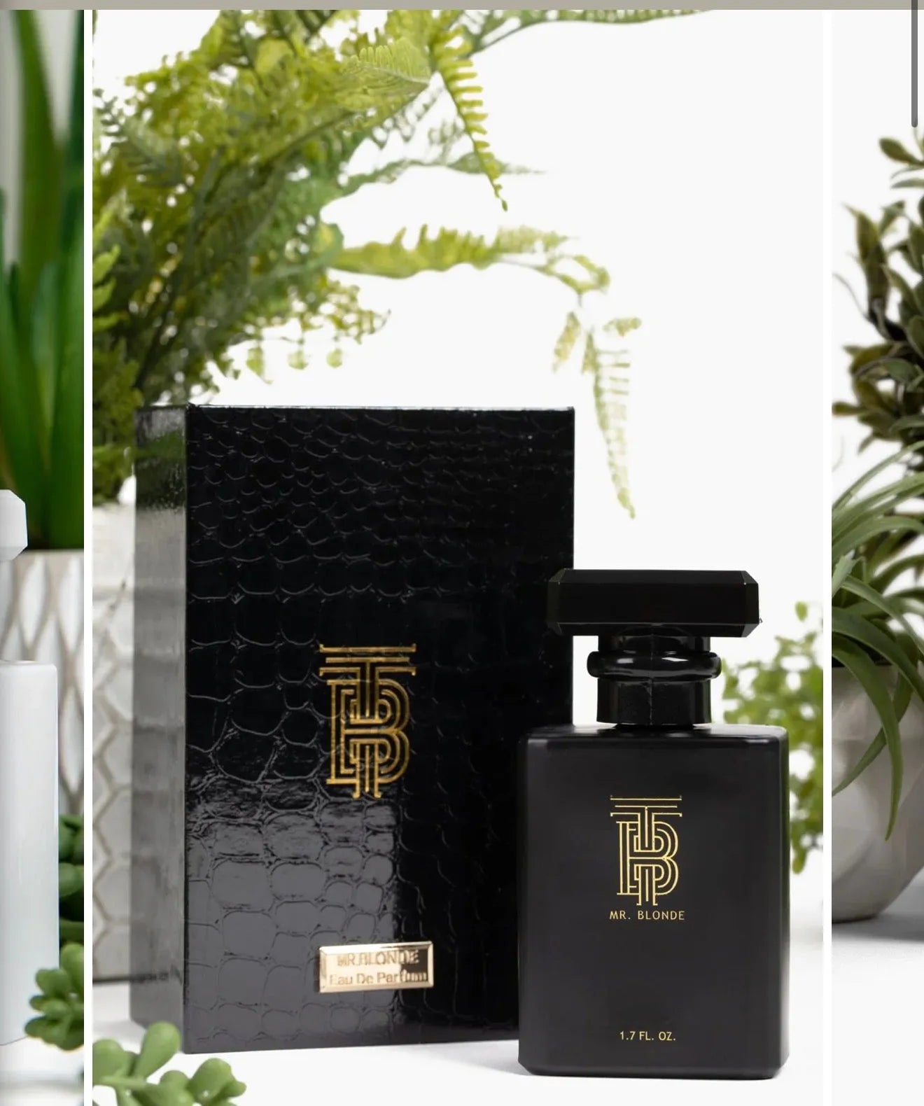 Black Eau de Parfum bottle by Thomas Blonde with gold logo and textured black box. 1.7 FL. OZ.