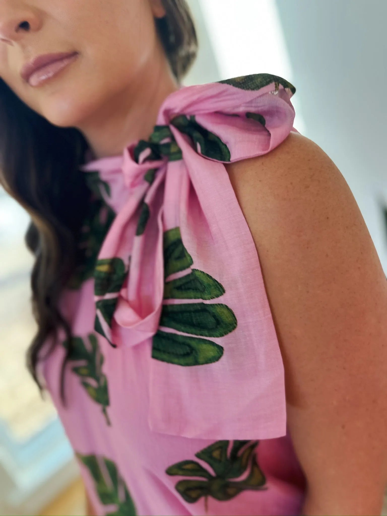 Entro pink maxi dress with a tie-neck and a tropical green palm leaf print.