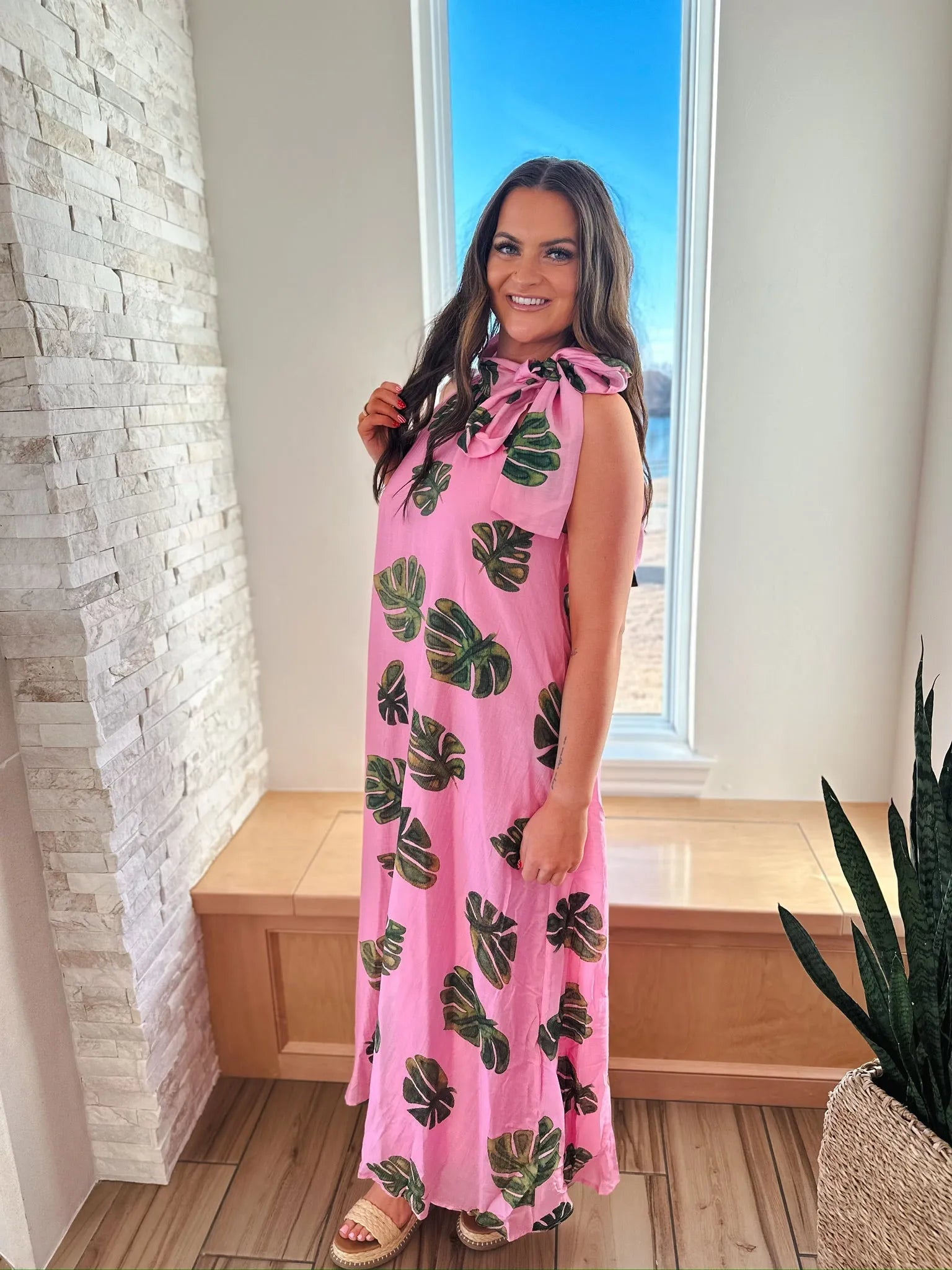Entro pink maxi dress with green palm leaf print and tie neck.