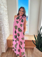 Entro pink maxi dress with a palm leaf print and a tie neck, shown on a woman.