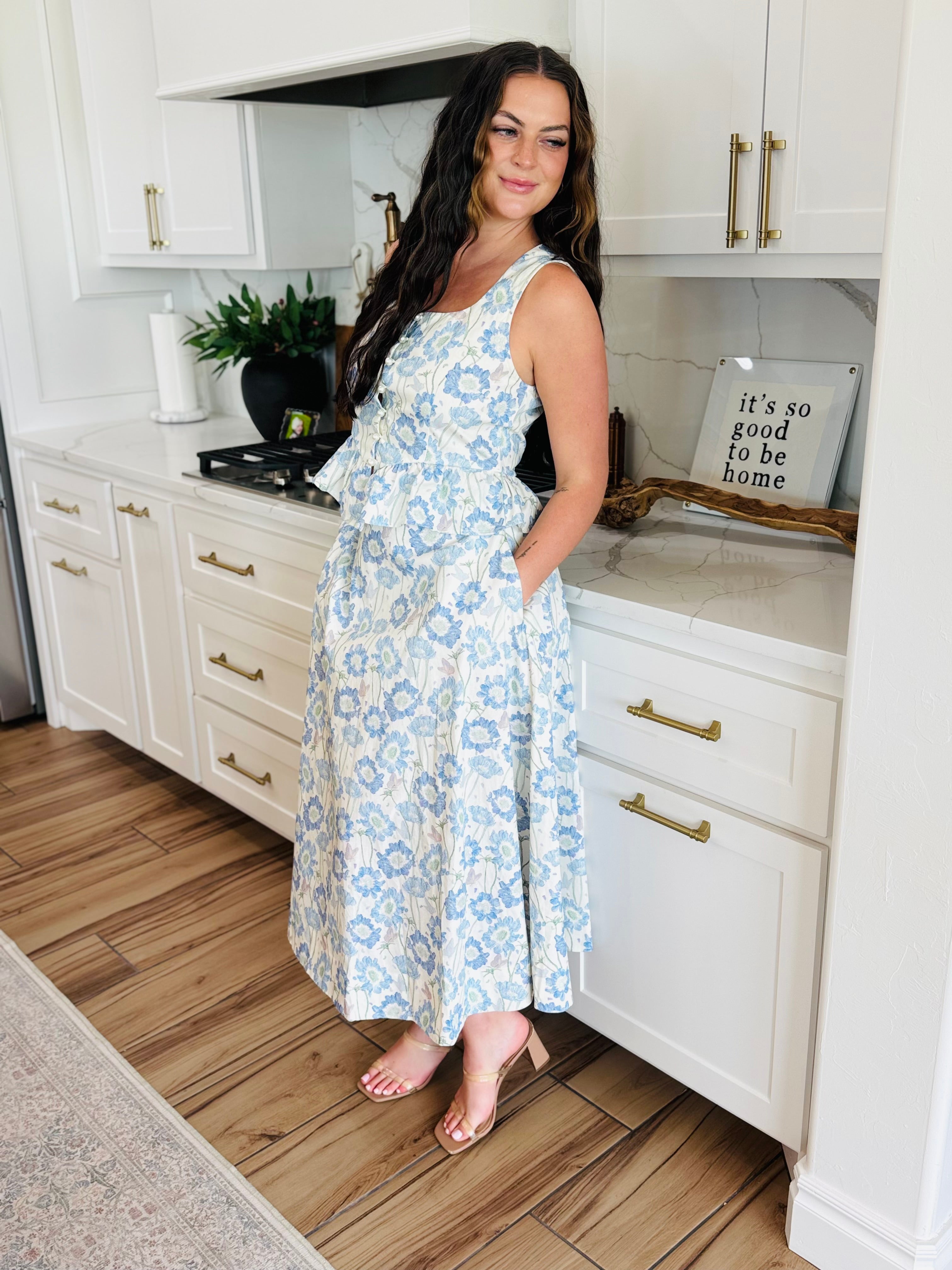Close-up of the ENTRO Sleeveless Southern Belle Top with Pearls highlighting delicate floral patterns and elegant pearl accents for a refined look.