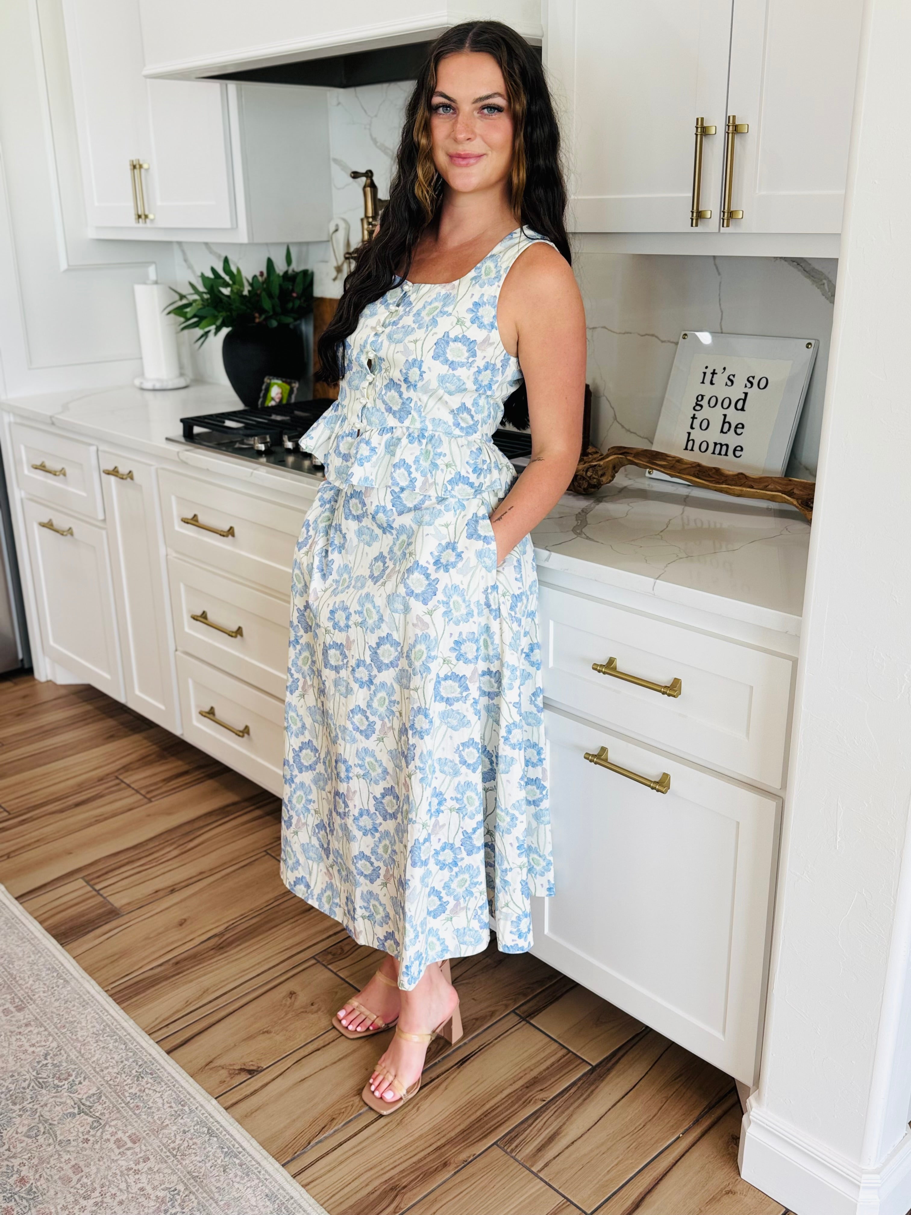 ENTRO Sleeveless Southern Belle Top with Pearls showcasing a floral design and faux pearl button details, ideal for warm weather and versatile styling.