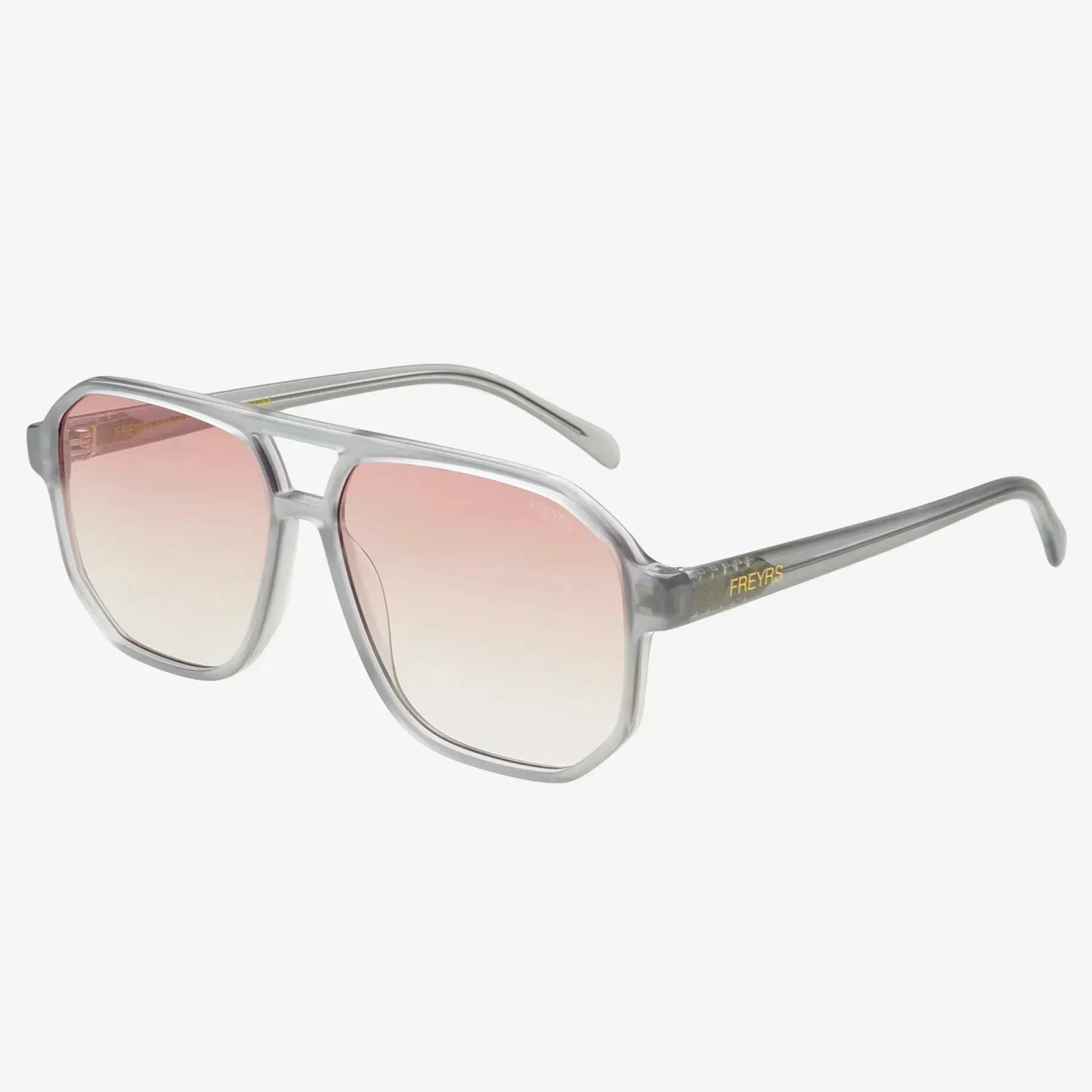 Freyrs Billie unisex aviator sunglasses with grey translucent frames and gradient pink lenses. The Freyrs logo is visible