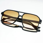 Freyrs Billie unisex aviator sunglasses with black frames and gradient brown lenses on a white background.