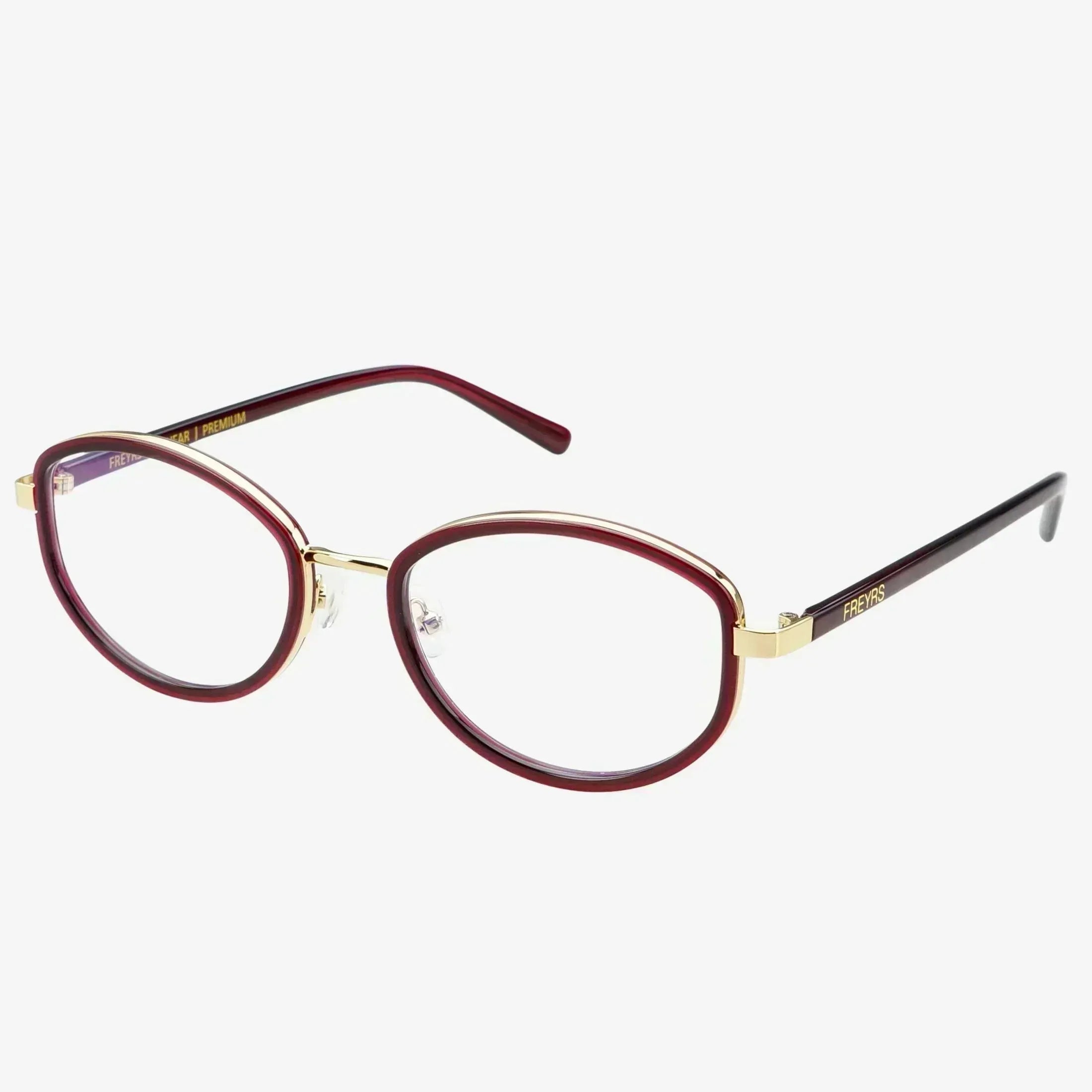 Freyrs Jordan Bold Modern Blue Light Reading Glasses with deep red oval frames and gold accents. Clear lenses.