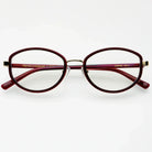 Freyrs Jordan bold modern blue light reading glasses with maroon oval frames and gold accents on a white background.